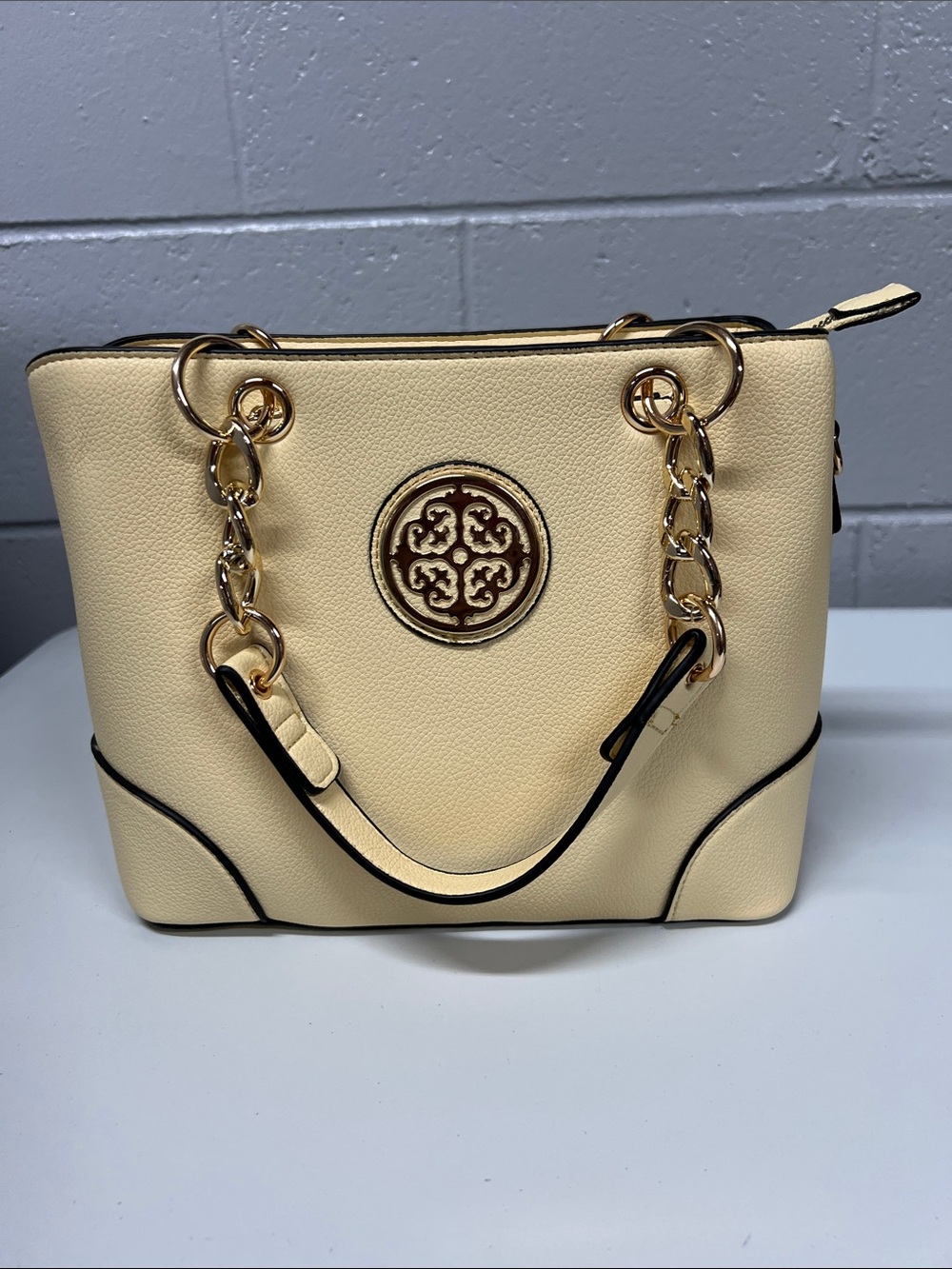 Elegant Cream Tote Bag with Gold Chain Accents